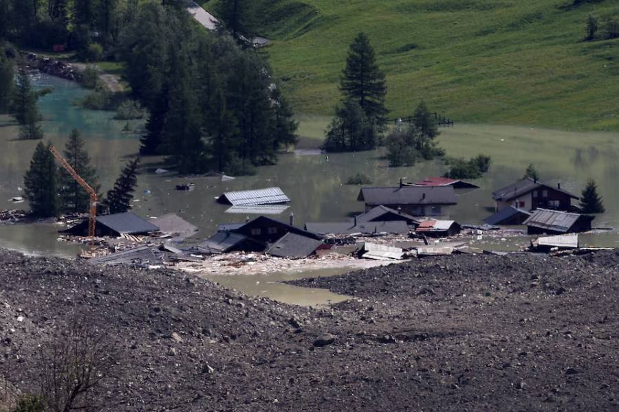 A few remaining houses are seen after a massive rock and ice slide covered most of the village of Blatten, Switzerland May 29, 2025.