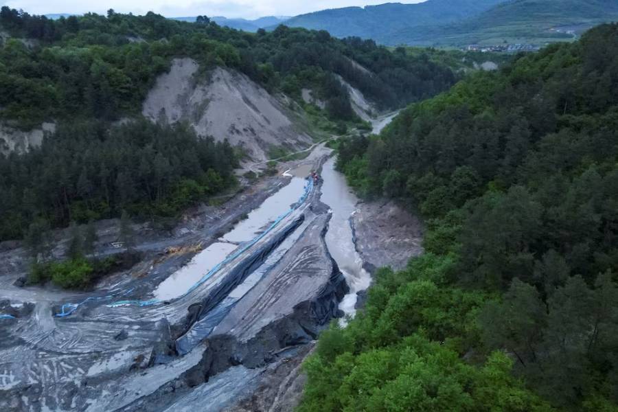 The swollen Corund river spills down inside the Praid Salt Mine following increased levels due to floods, in Harghita, Romania, May 28, 2025.