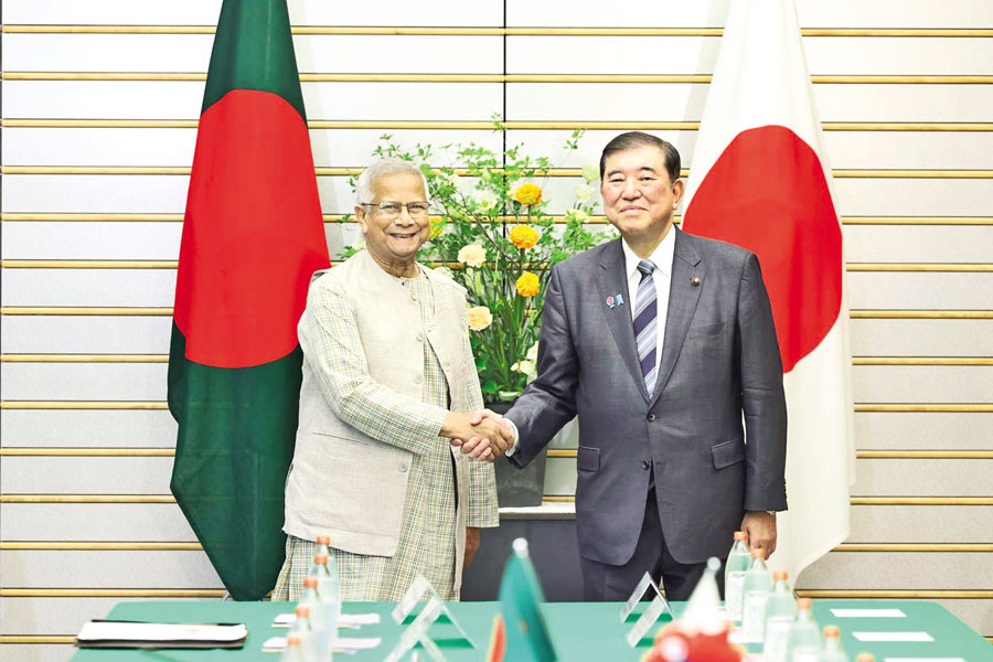 Chief Adviser Professor Muhammad Yunus and Japanese Prime Minister Ishiba Shigeru shake hands at a bilateral meeting in Tokyo on Friday.— PID