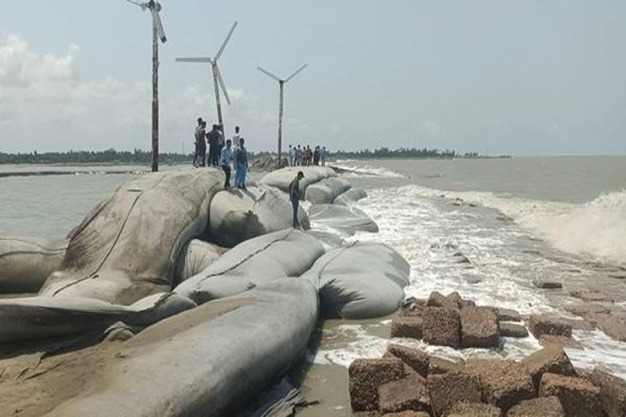 Photo shows an embankment damaged under the pressure of inflowing tide in Kutubbdia upazila of Cox's Bazar district - FE Photo