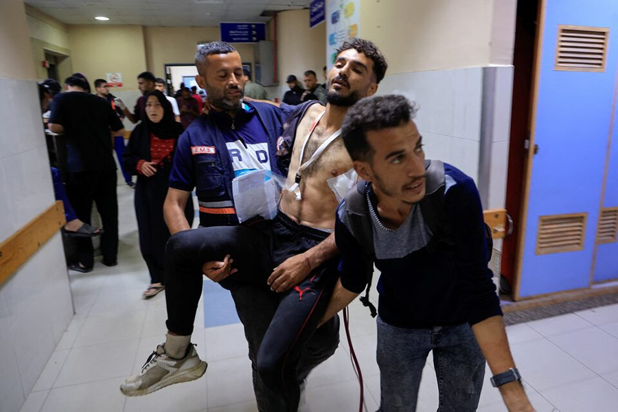 A paramedic carries a Palestinian man wounded in an Israeli strike, at Nasser Hospital, in Khan Younis, in the southern Gaza Strip on June 1, 2025 — Reuters photo