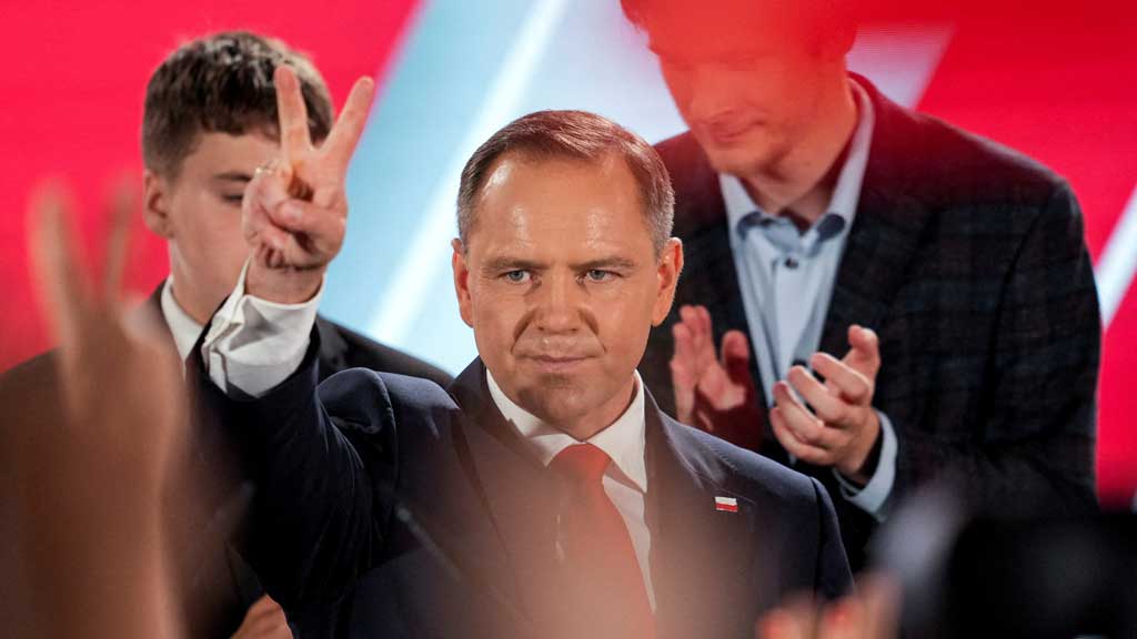 Polish presidential candidate Karol Nawrocki, backed by the main opposition Law and Justice (PiS) party, reacts to the exit polls of the second round of the presidential election, in Warsaw, Poland, Jun 1, 2025. REUTERS/Aleksandra Szmigiel