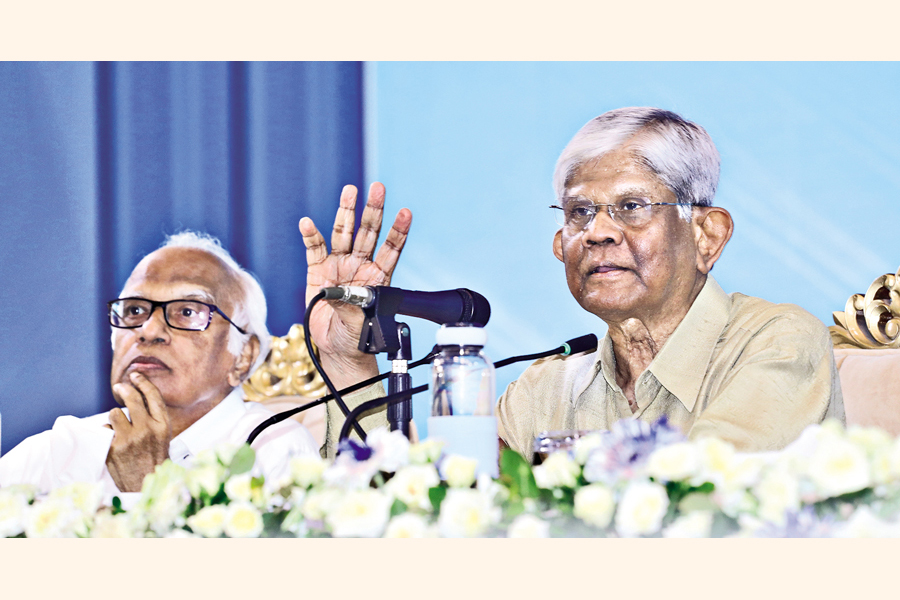 Finance Adviser Dr Salehuddin Ahmed addresses a post-budget press conference at the Osmani Memorial Auditorium in the capital on Tuesday. Planning Adviser Dr Wahiduddin Mahmud is seen on his right. — FE Photo