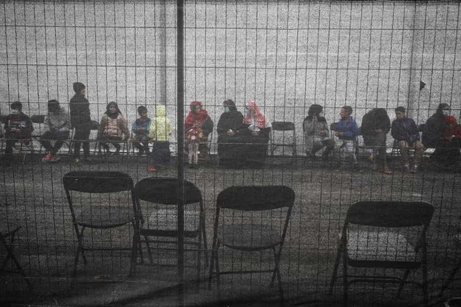 Afghan refugees queue outside a distribution and donation center at Liberty Village on Joint Base McGuire-Dix-Lakehurst in New Jersey, US on December 2, 2021 — Reuters/File