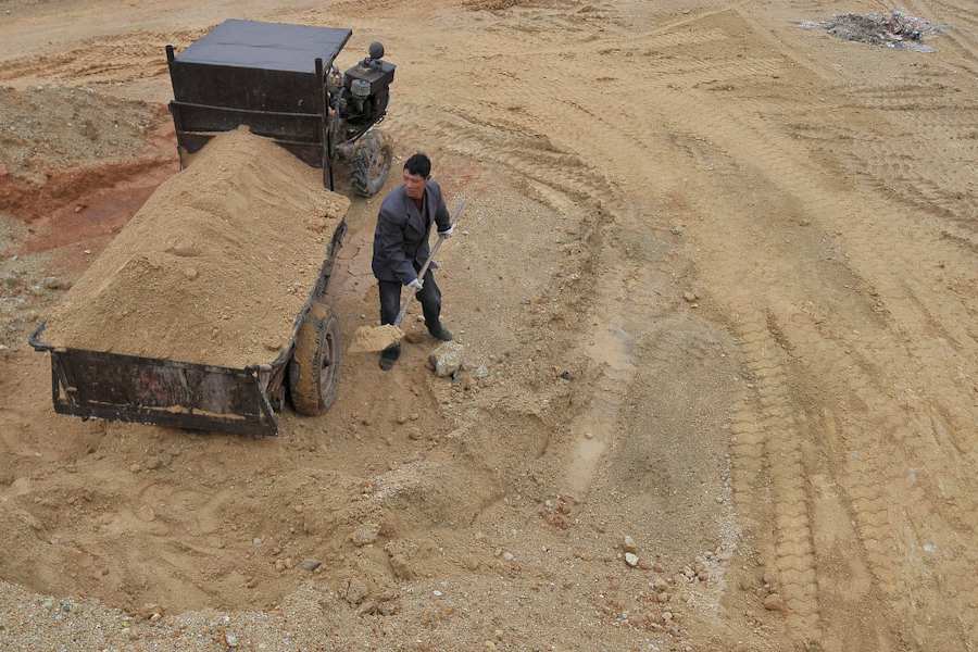 A labourer works at a site of a rare earth metals mine at Nancheng county, Jiangxi province March 14, 2012.