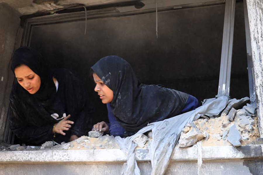 Women react at the site of an Israeli strike on a house, in Gaza City on June 7, 2025 — Reuters photo