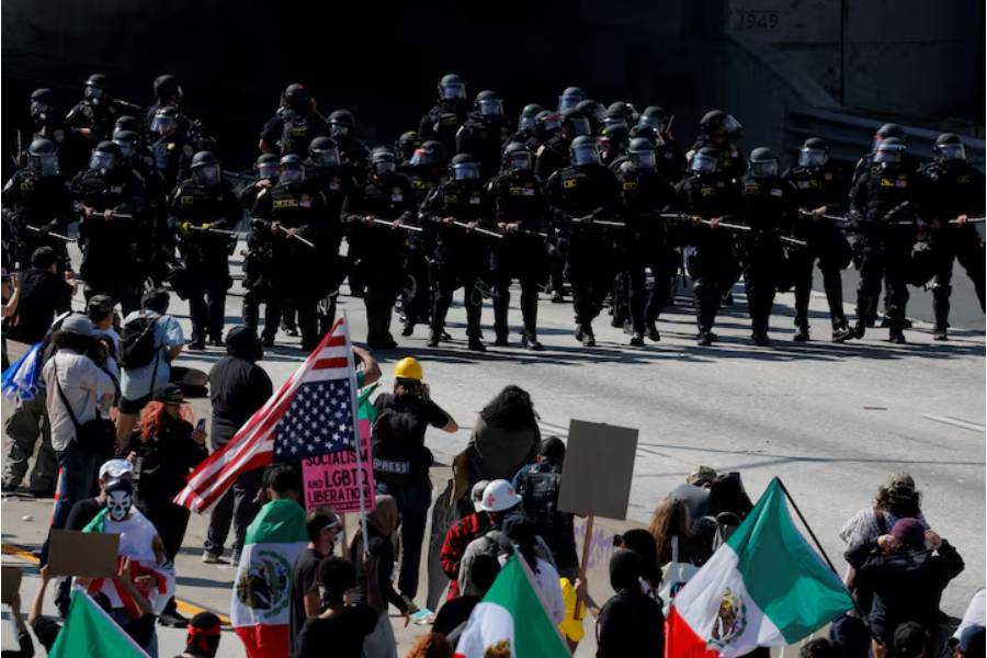 Police face off with demonstrators during a protest against federal immigration sweeps in downtown Los Angeles, California, June 8.