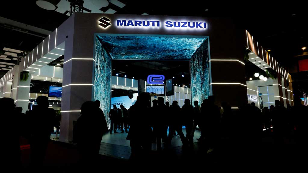 FILE PHOTO: People visit Maruti Suzuki's stand at India's five-day auto show in New Delhi, India, January 18, 2025. REUTERS/Priyanshu Singh/File Photo