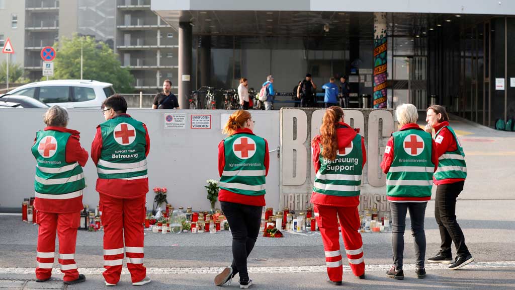 Emergency personnel stand in front of the site of a deadly shooting at a secondary school, in Graz, Austria, Jun 11, 2025. REUTERS