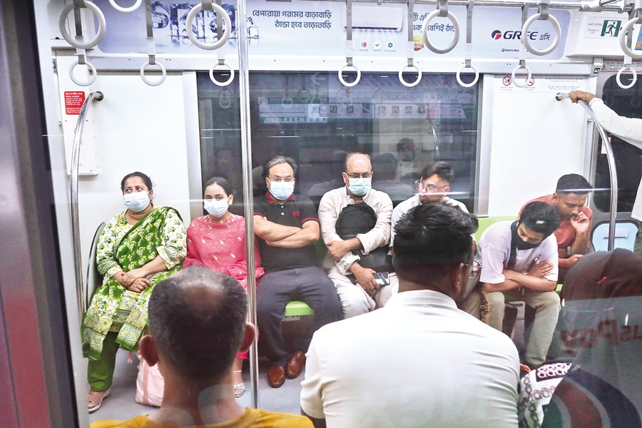 Amid a fresh resurgence of coronavirus throughout the country, people have been instructed to comply with health guidelines to curb the spread of the respiratory disease. In the picture taken at metro rail on Wednesday, people are seen wearing masks as a precautionary measure