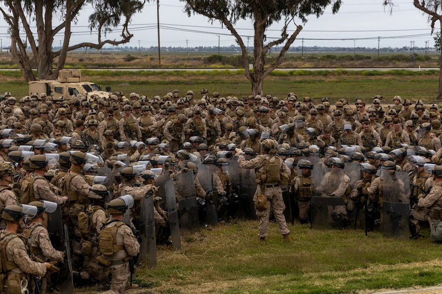 US Marines with 2nd Battalion, 7th Marine Regiment, 1st Marine Division, who were placed in an alert status over the weekend, are briefed by battalion leadership while rehearsing crowd control tactics at a base in the greater Los Angeles area, California, US, June 10, 2025.