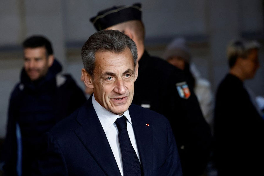 Former French president Nicolas Sarkozy arrives for his appeal trial on charges of corruption and influence peddling, at Paris courthouse, France, December 15, 2022.