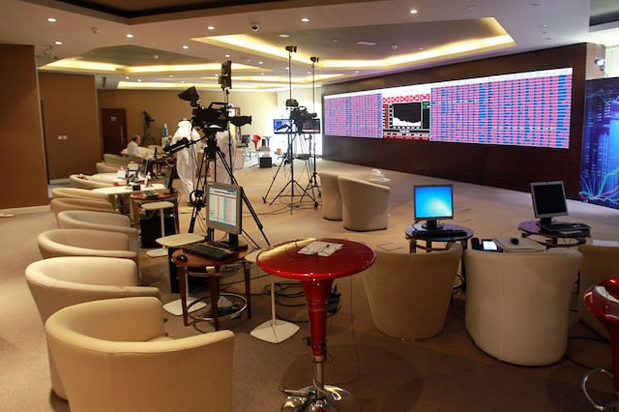 Screens displaying stock information are seen at Qatar Stock Exchange in Doha, Qatar June 5, 2017.