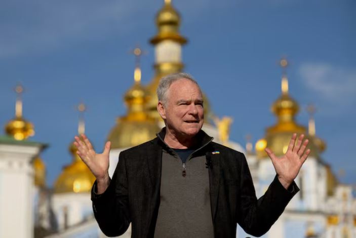 U.S. Senator Tim Kaine (D-VA) speaks to members of the media in front of Saint Michael's Cathedral, amid Russia's attack on Ukraine, in Kyiv, Ukraine April 14, 2025. REUTERS/Thomas Peter/File Photo