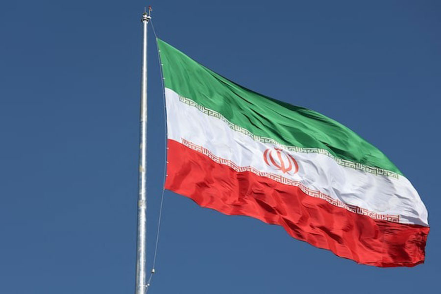 The Iranian flag flutters outside the IAEA headquarters in Vienna, Austria, June 9, 2025.