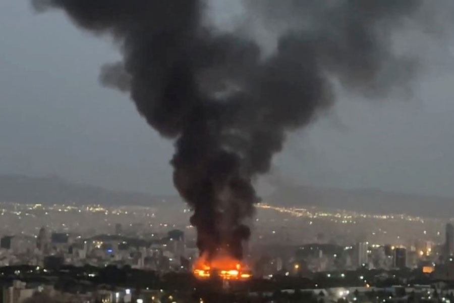 Smoke rises from a fire, as the Israel-Iran air war continues, in Tehran, Iran, in this still image obtained from social media video released June 17, 2025.