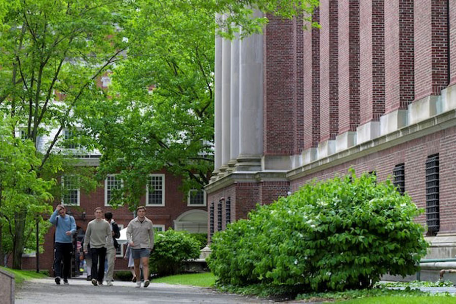 Students walk on the campus of Harvard University in Cambridge, Massachusetts, US, May 23, 2025.