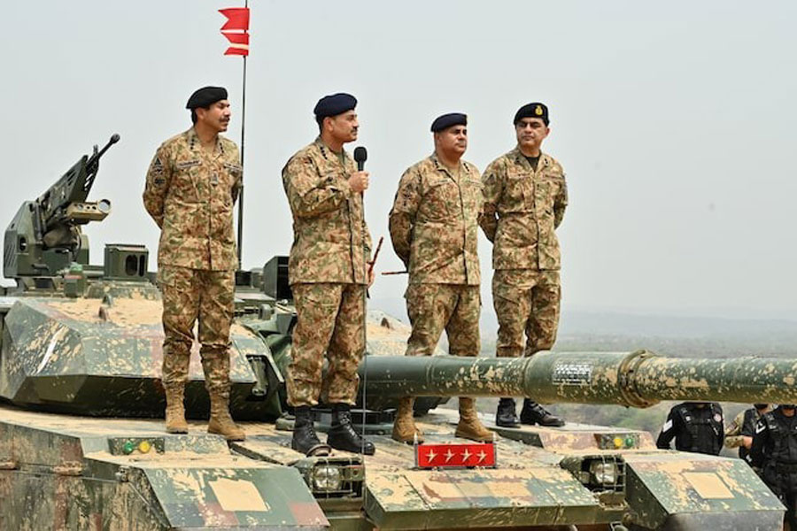 Chief of Army Staff of Pakistan Asim Munir holds a microphone during his visit at the Tilla Field Firing Ranges (TFFR) to witness the Exercise Hammer Strike, a high-intensity field training exercise conducted by the Pakistan Army's Mangla Strike Corps, in Mangla, Pakistan May 1, 2025.
