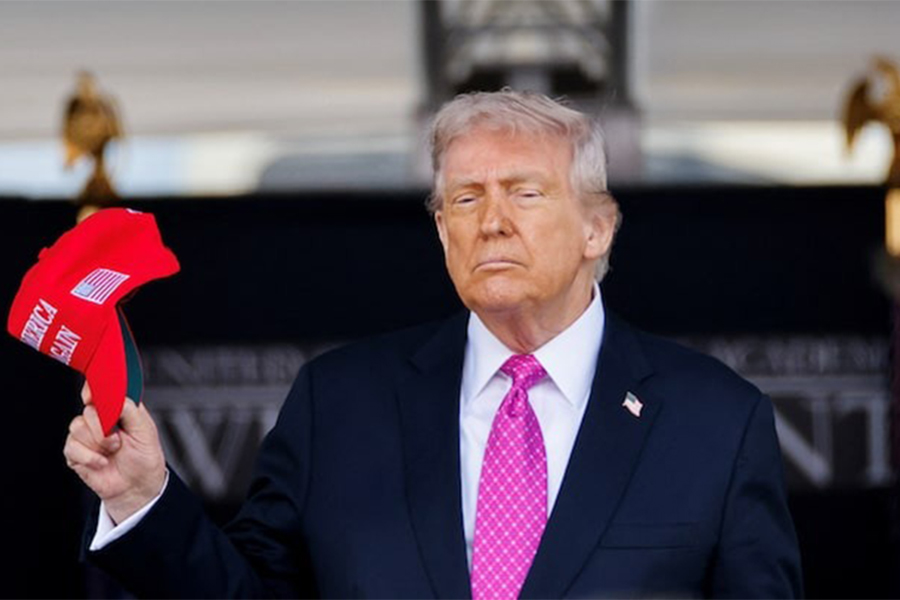 US President Donald Trump holds a 'Make America Great Again' (MAGA) hat as he attends the commencement ceremony at West Point Military Academy in West Point, New York, US, on May 24, 2025 — Reuters/File
