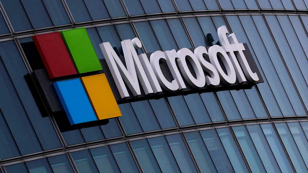 FILE PHOTO: A view shows a Microsoft logo at Microsoft offices in Issy-les-Moulineaux near Paris, France, Mar 21, 2025. REUTERS/Gonzalo Fuentes/File Photo