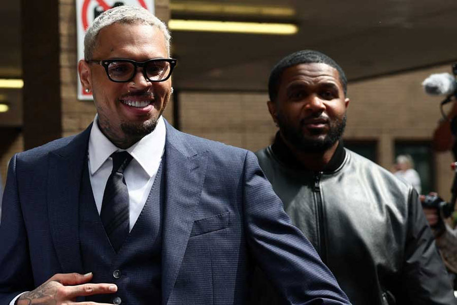 US singer Chris Brown, who has been charged with inflicting grievous bodily harm in what prosecutors said was an "unprovoked attack" on a music producer at the Tape nightclub in central London in 2023, walks outside Southwark Crown Court in London, Britain, June 20, 2025.