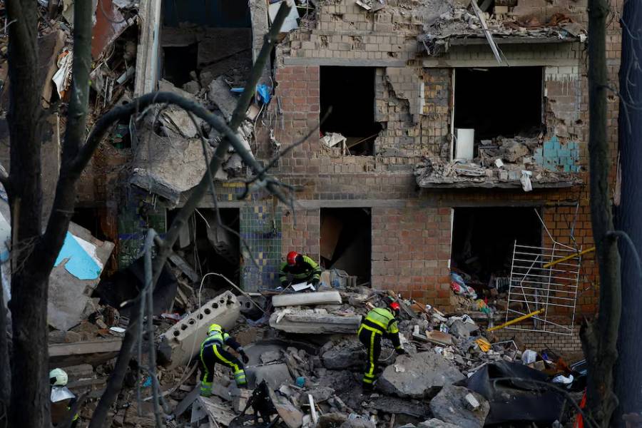 Firefighters work at the site of an apartment building hit during Russian drone and missile strikes, amid Russia’s attack on Ukraine, in Kyiv, Ukraine June 23, 2025.