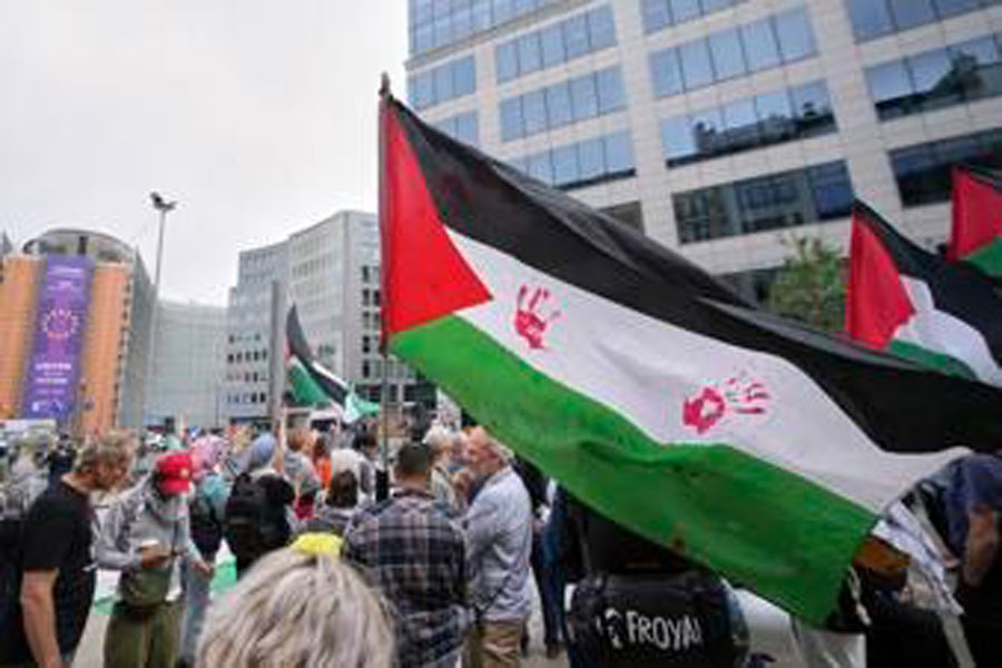 People attend a protest in support of Palestinians outside a meeting of EU foreign ministers at the European Council building in Brussels, Monday, June 23, 2025.