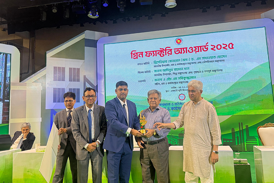 Md Shahriar, Managing Director of Adzi Trims Ltd, seen receiving the Green Factory Award at a ceremony held at Osmani Memorial Auditorium in Dhaka on Tuesday