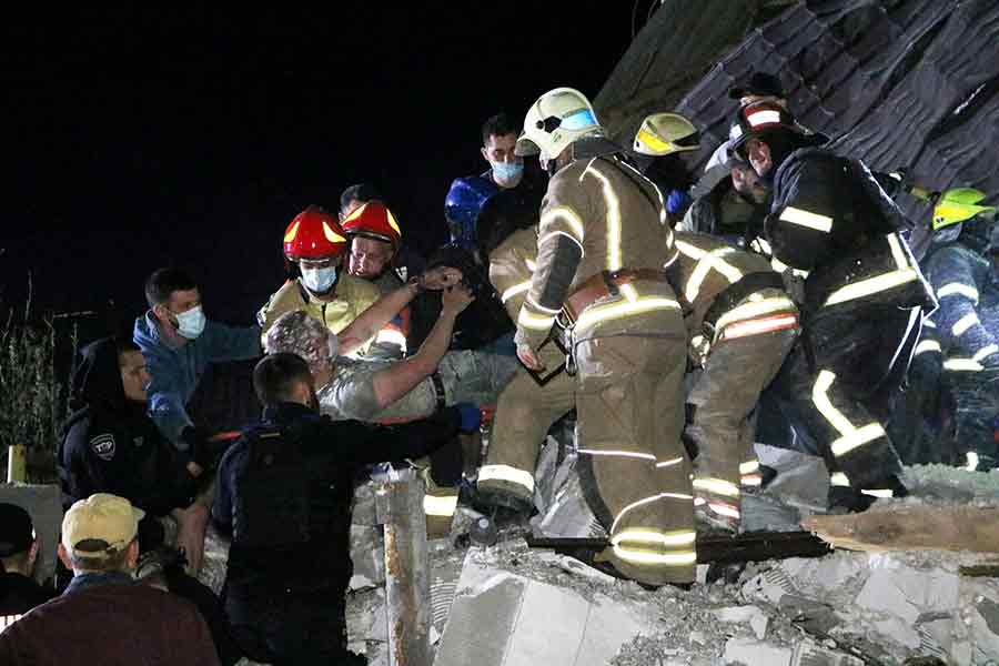 Emergency workers rescuing a man from debris of a residential building heavily damaged by a Russian missile strike on outskirt of the Dnipro city in Ukraine on Saturday –Reuters photo