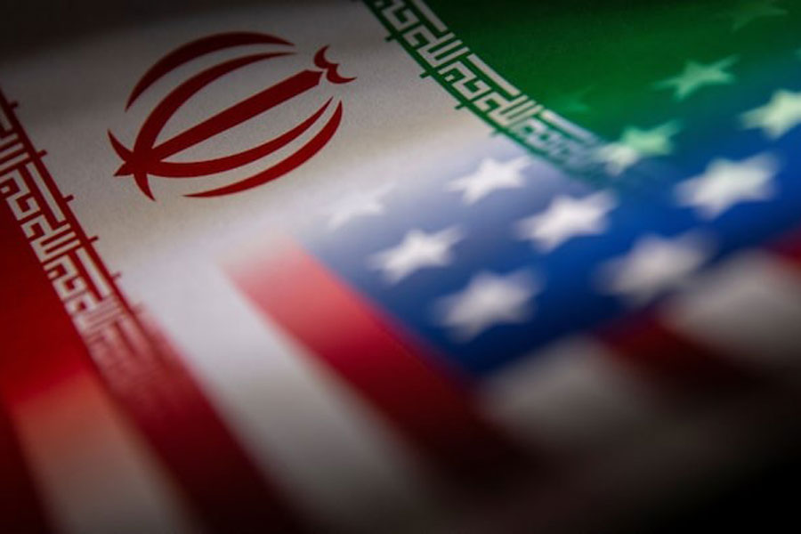 Iran's and US' flags are seen printed on paper in this illustration taken January 27, 2022.