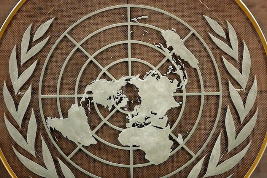 The logo of the United Nations is seen in the General Assembly hall before heads of state begin to address the 76th Session of the UN General Assembly in New York City, US, September 21, 2021.