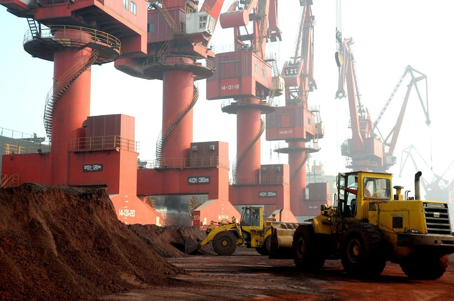 Workers transport soil containing rare earth elements for export at a port in Lianyungang, Jiangsu province, China October 31, 2010.