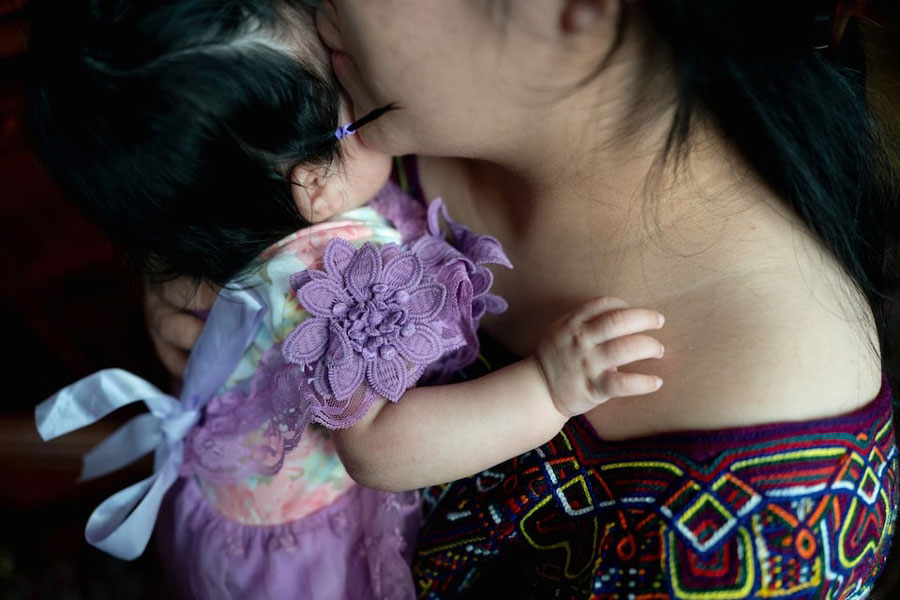 An anonymous plaintiff, identified as Marta, in Trump v. CASA holds her 3-month-old daughter at the CASA Multicultural Center in Hyattsville, Maryland, US, June 27, 2025.