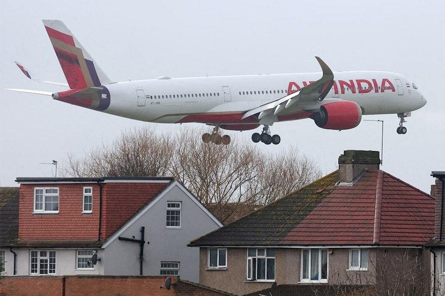 An Air India passenger plane flies near houses as it makes its landing approach to Heathrow Airport in west London, Britain on January 28, 2025 — Reuters/File