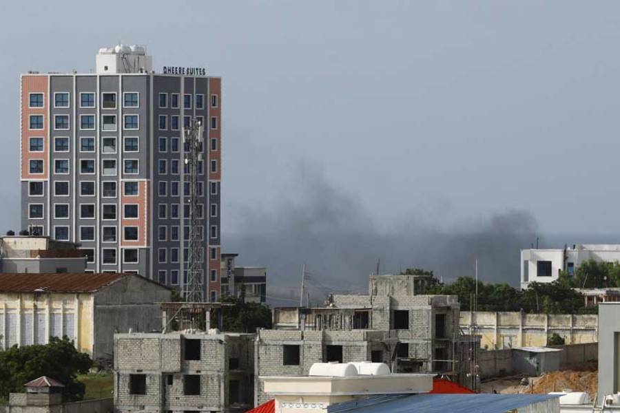 Smoke rises in the direction of Aden Adde airport following an African Union helicopter crash, in Mogadishu, Somalia, Jul 2, 2025.