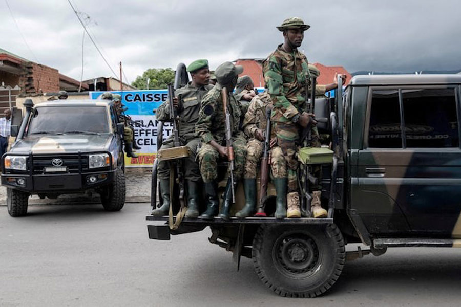 Members of the M23 rebel group mount their vehicles after the opening ceremony of Caisse Generale d’epargne du Congo in Goma, North Kivu province in the East of the Democratic Republic of Congo, April 7, 2025.