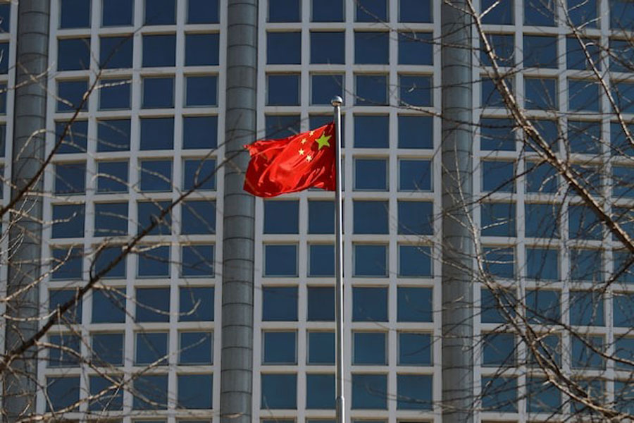A Chinese flag flutters outside the Chinese foreign ministry in Beijing, China February 24, 2022.