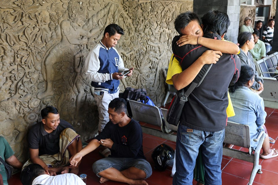 Kholil, 26, a survivor of the KMP Tunu Pratama Jaya ferry sinking, reacts as he meets with his relative after a ferry carrying 65 people sank near the Indonesian island of Bali, at Gilimanuk port in Bali, Indonesia on July 3, 2025 — Reuters photo