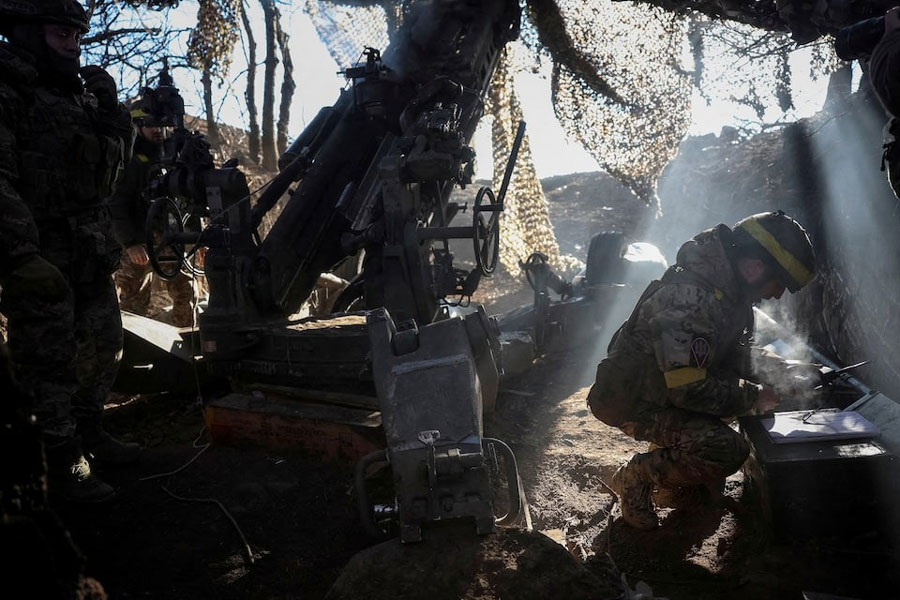 Servicemen of the 148th Separate Artillery Zhytomyr Brigade of the Armed Forces of Ukraine prepare to fire a M777 Howitzer towards Russian troops at a position in the front line, amid Russia's attack on Ukraine, in Donetsk region, Ukraine, February 8, 2025.