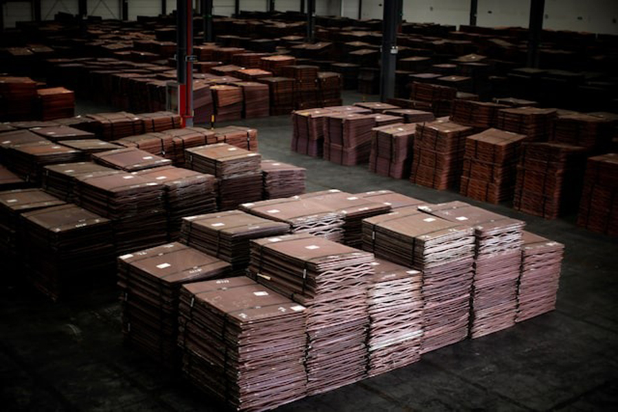 Copper cathodes are seen inside a warehouse near Yangshan Deep Water Port, south of Shanghai on March 23, 2012 — Reuters/File