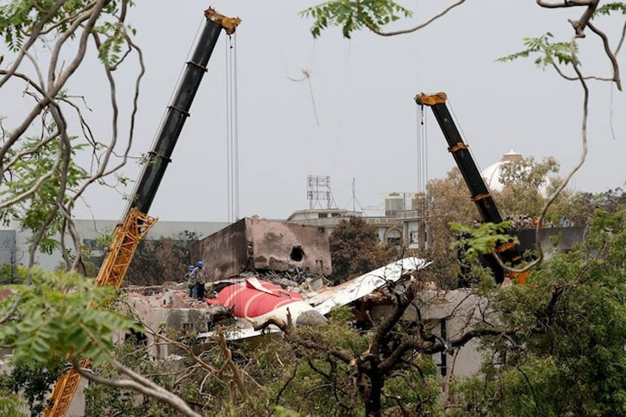 Members of Indian Army's engineering arm prepare to remove the wreckage of an Air India aircraft, bound for London's Gatwick Airport, which crashed during take-off from an airport in Ahmedabad, India June 14, 2025.