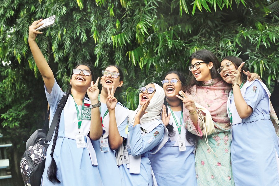 Students of Viqarunnisa Noon School & College who have passed the SSC examinations with flying colours celebrate at their institution in Dhaka on Thursday. — FE Photo by K Asad-Uz-Zaman