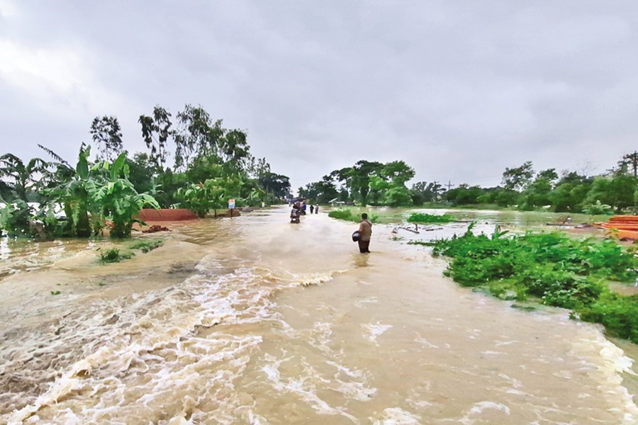 New areas of Feni have been flooded due to damage to flood control embankments along several rivers following torrential rainfall over the past few days. Water, however, has begun to recede in Parshuram upazila of the district. The photo was taken on Thursday. — Focus Bangla