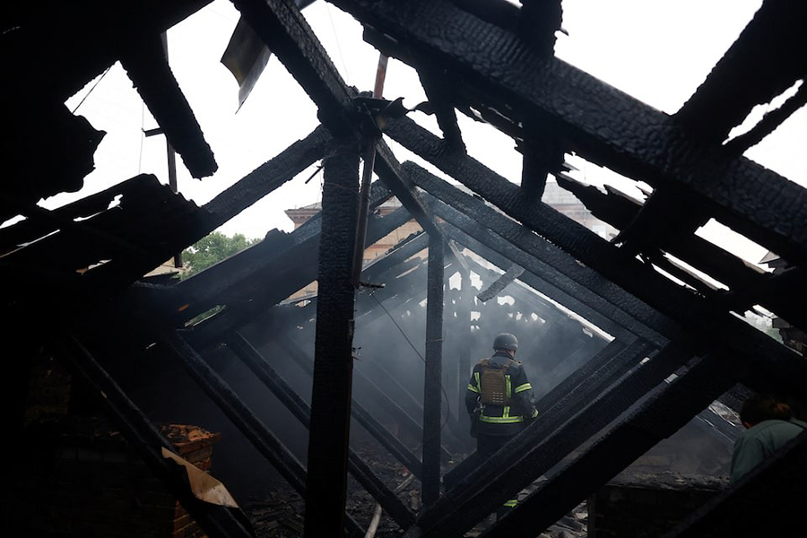 A firefighter stands on a roof of an apartment building, damaged during Russian drone and missile strikes, amid Russia's attack on Ukraine, in Kyiv, Ukraine on July 10, 2025 — Reuters photo