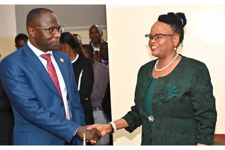 Independent Electoral and Boundaries Commission (IEBC) Chairman Erastus Ethekon greets Chief Justice Martha Koome after taking oath, at the Supreme Court building in Nairobi, Kenya July 11, 2025.