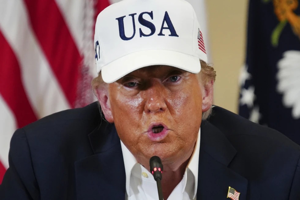 FILE - Members of the Mexican National Guard patrol along the border wall separating Mexico and the United States, in Tijuana, Jan. 20, 2025. (AP Photo/Gregory Bull, File)