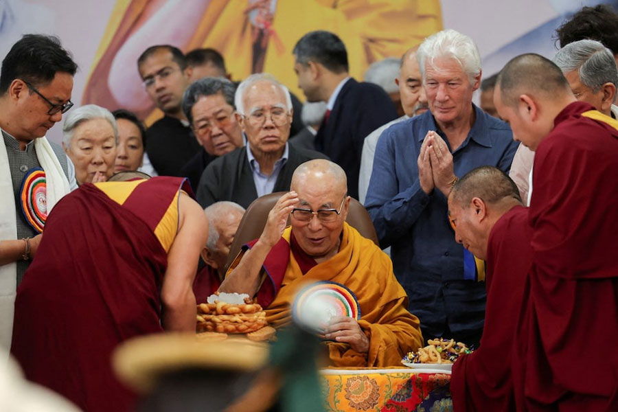 Tibetan spiritual leader, the 14th Dalai Lama, is served food on his 90th birthday celebration at the Tsuglagkhang, also known as the Dalai Lama Temple complex, in the northern town of Dharamshala, India, July 6, 2025.