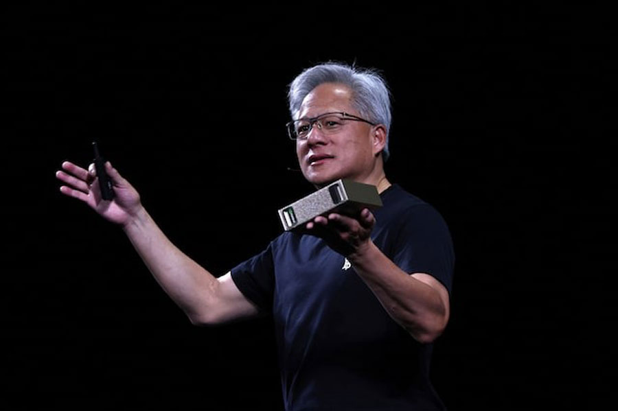 Jensen Huang, CEO of Nvidia, holds a NVIDIA DGX Cloud Lepton as he speaks during the Viva Technology conference dedicated to innovation and startups at Porte de Versailles exhibition center in Paris, France, June 11, 2025.