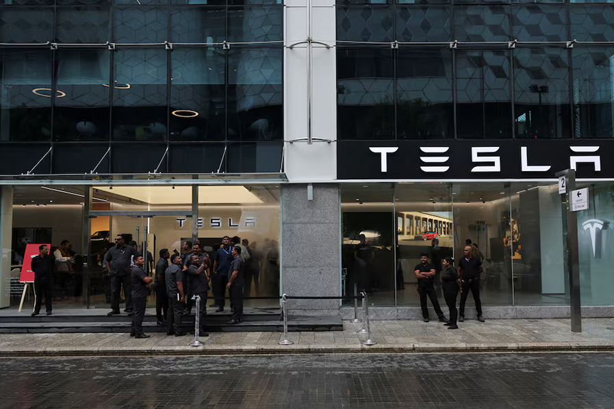 People are seen outside the Tesla showroom ahead of its opening in Mumbai, India on July 15, 2025 — Reuters photo