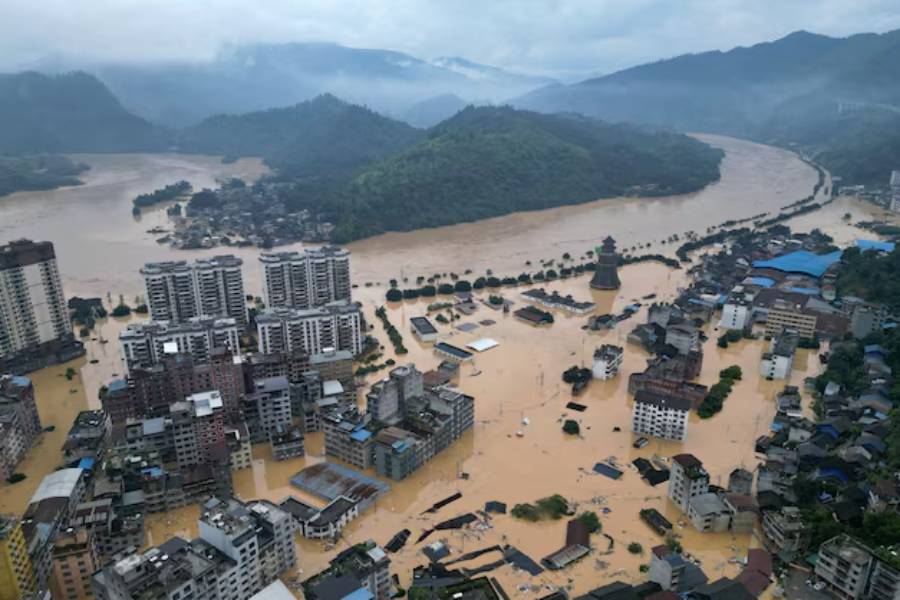 A drone view shows buildings and roads are half submerged in floodwaters after heavy rainfalls, in Rongjiang county, Guizhou province, China June 24, 2025.